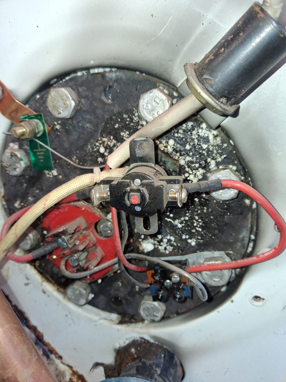 Geyser element and thermostat being serviced