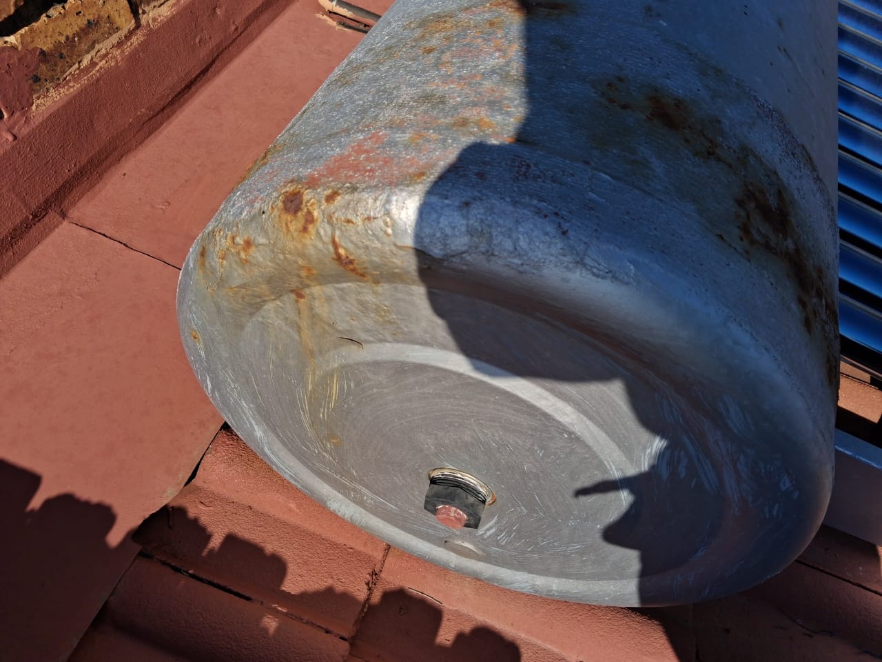 Galvanised water tank detail on a roof