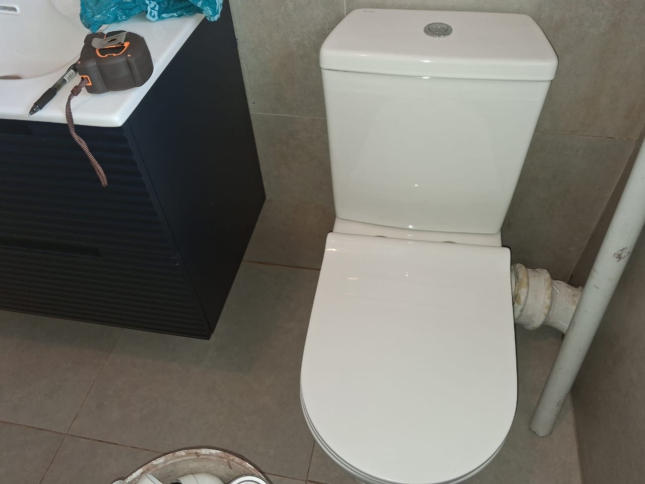 White close-coupled toilet installed